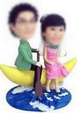 Couple bobble head doll in rowing