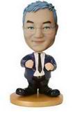 Male bobble head doll  in blue suit