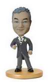 Male bobble head doll in suit