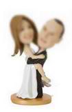 Wedding bobblehead male holds the female