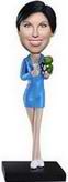 Female bobble head doll with  blue clothes