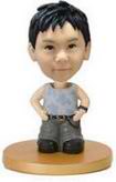 The little boy bobble head doll with gray pants