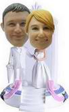 The bride and groom bobblehead in front of the church