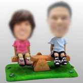 See-Saw Couple bobble head doll