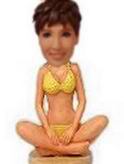 Yellow bikini bobble head doll