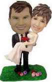 The men bobblehead hold women on the grass.