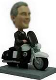 Man bobble head doll  on the black motorcycle