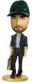 Handsome man bobble head doll in suit