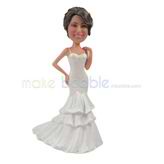 The bride wears a long dress custom bobbleheads