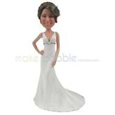 The bride wears a long dress custom bobbleheads