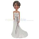 The bride wears a long dress custom bobbleheads