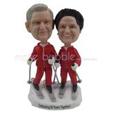 The couple are skiing custom bobbleheads