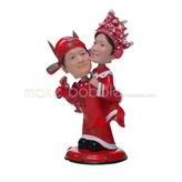 The couple are wearing costume custom bobbleheads