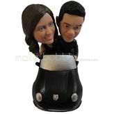 The couple sit in the car custom bobbleheads