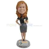 The female reporter is speaking custom bobbleheads