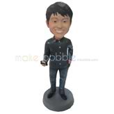 The man carries a mobile telephone custom bobbleheads