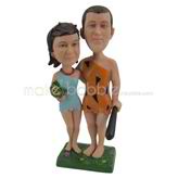 The man dresses in primitive clothing and his wife custom bobbleheads