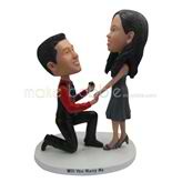 The man is wearing a ring to his wife custom bobbleheads