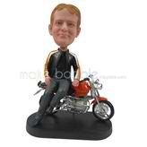 Custom man bobbleheads sit on his motobike