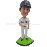 The man takes a golf ball custom bobbleheads