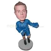 The man wears a blue tracksuit custom bobbleheads