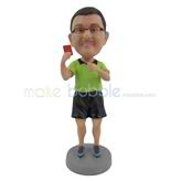 The man wears a green shirt custom bobbleheads