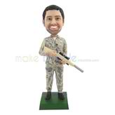 The soldier holds a rifle custom bobbleheads