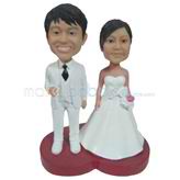 The white suit man and his wife custom bobbleheads