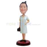 The woman carries a bag custom bobbleheads