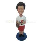 The woman holds a bag custom bobbleheads