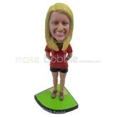 Custom woman bobbleheads sits on the playground