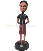 Custom woman bobbleheads stands next to a microphone