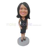 The woman wears a dress custom bobbleheads