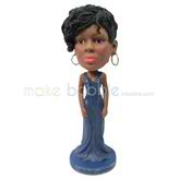 The woman wears a dress custom bobbleheads