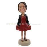 The woman wears a red dress custom bobbleheads