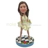 The woman wears dress custom bobbleheads