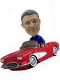 The man bobblehead with the red car