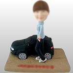 Women bobble head doll with car