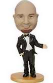 Male bobble head doll in black suit