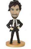 Male bobble head doll in suit Akimbo